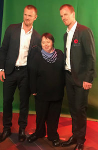 Photo of Cindy with the Sedin twins.